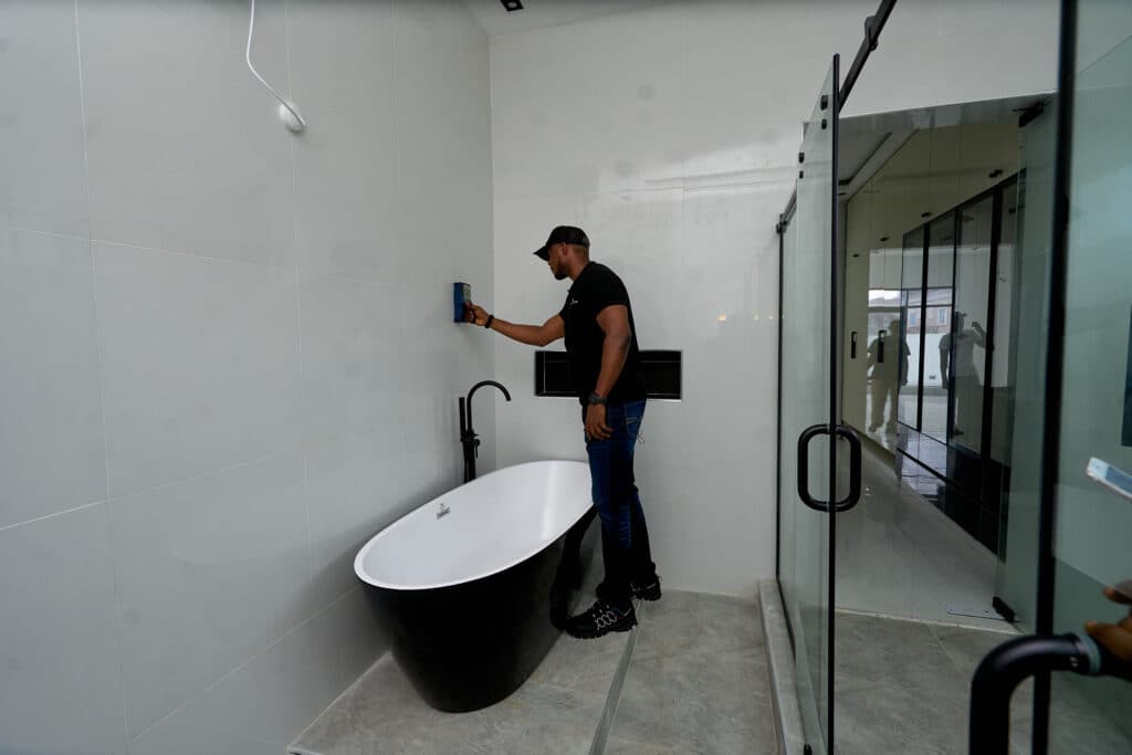 HINL inspector uncovering hidden defects during a property audit