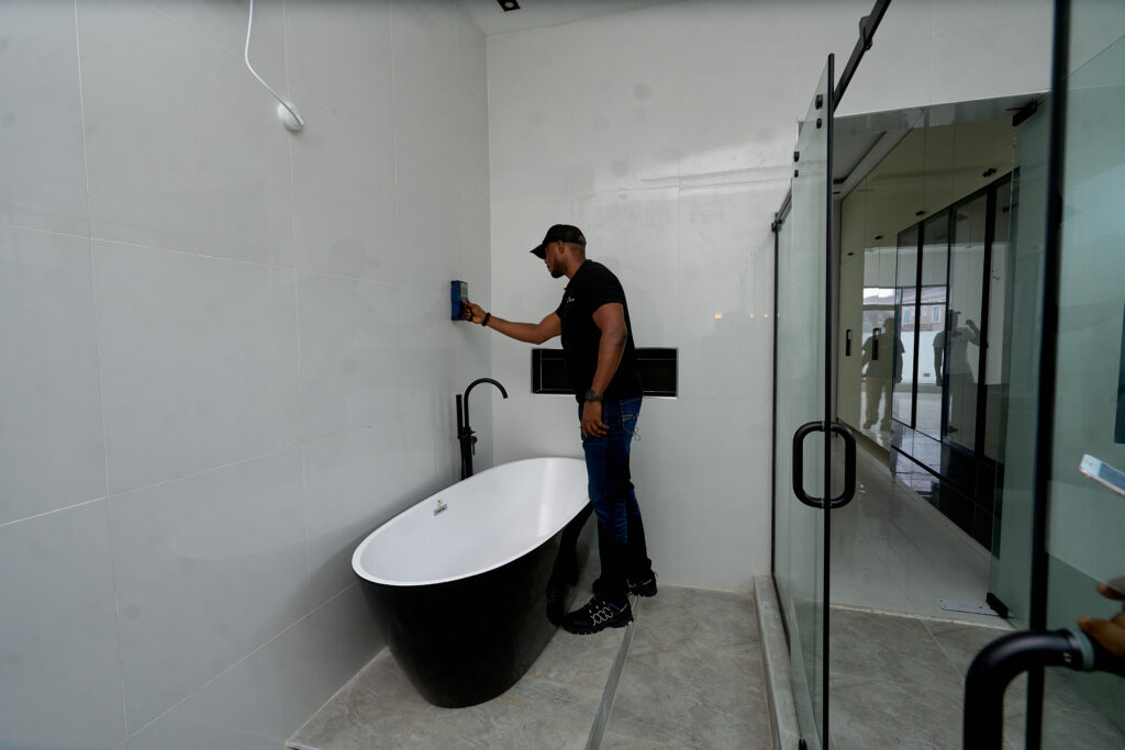 HINL inspector uncovering hidden defects during a property audit